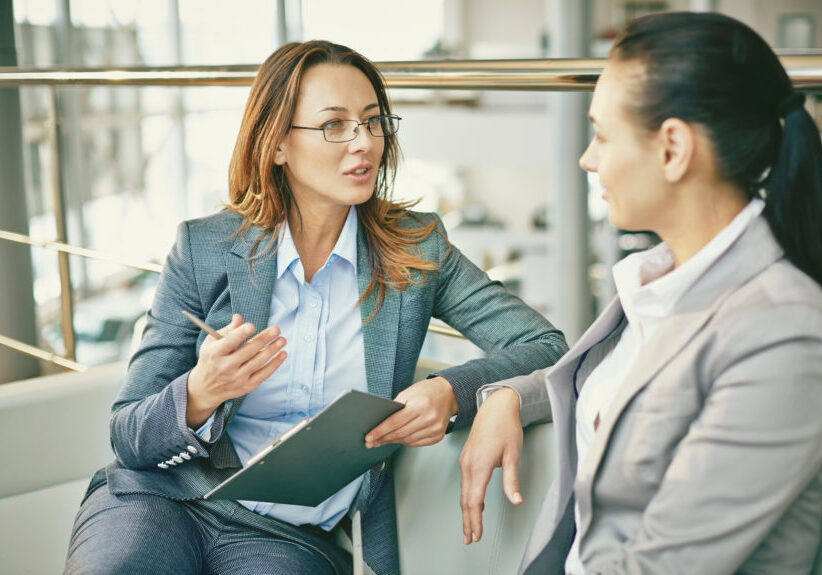 Hr manager asking questions to female candidate